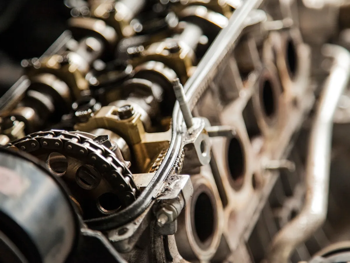Close-up of an engine timing chain and drive belt pulleys