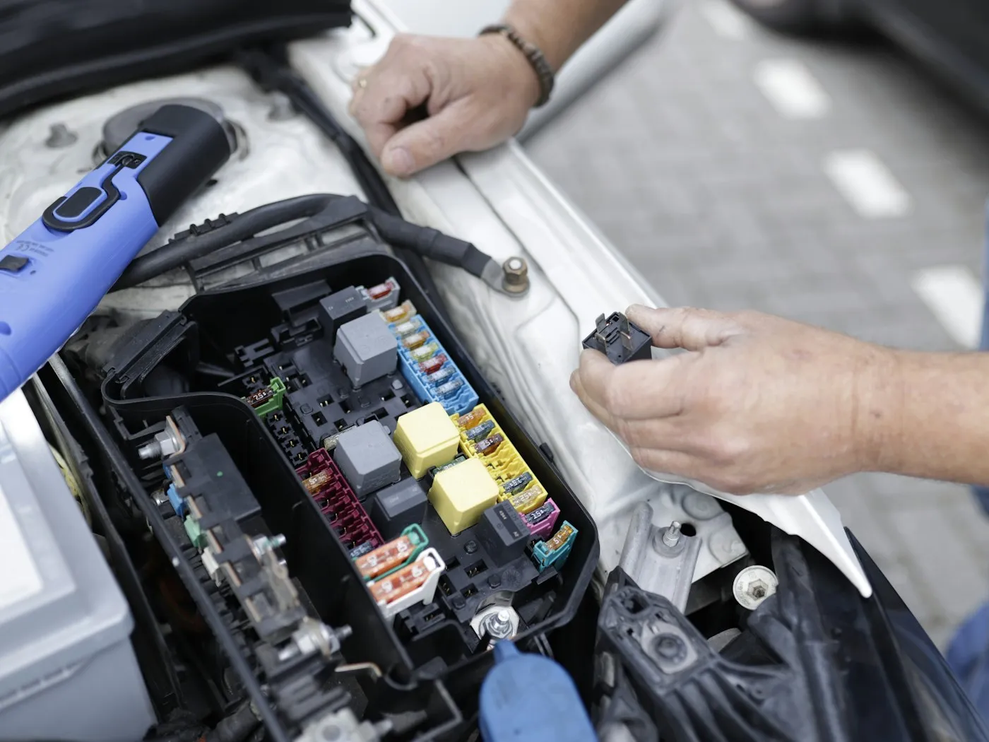 Torqueside mechanic working on a vehicle on a customer's driveway